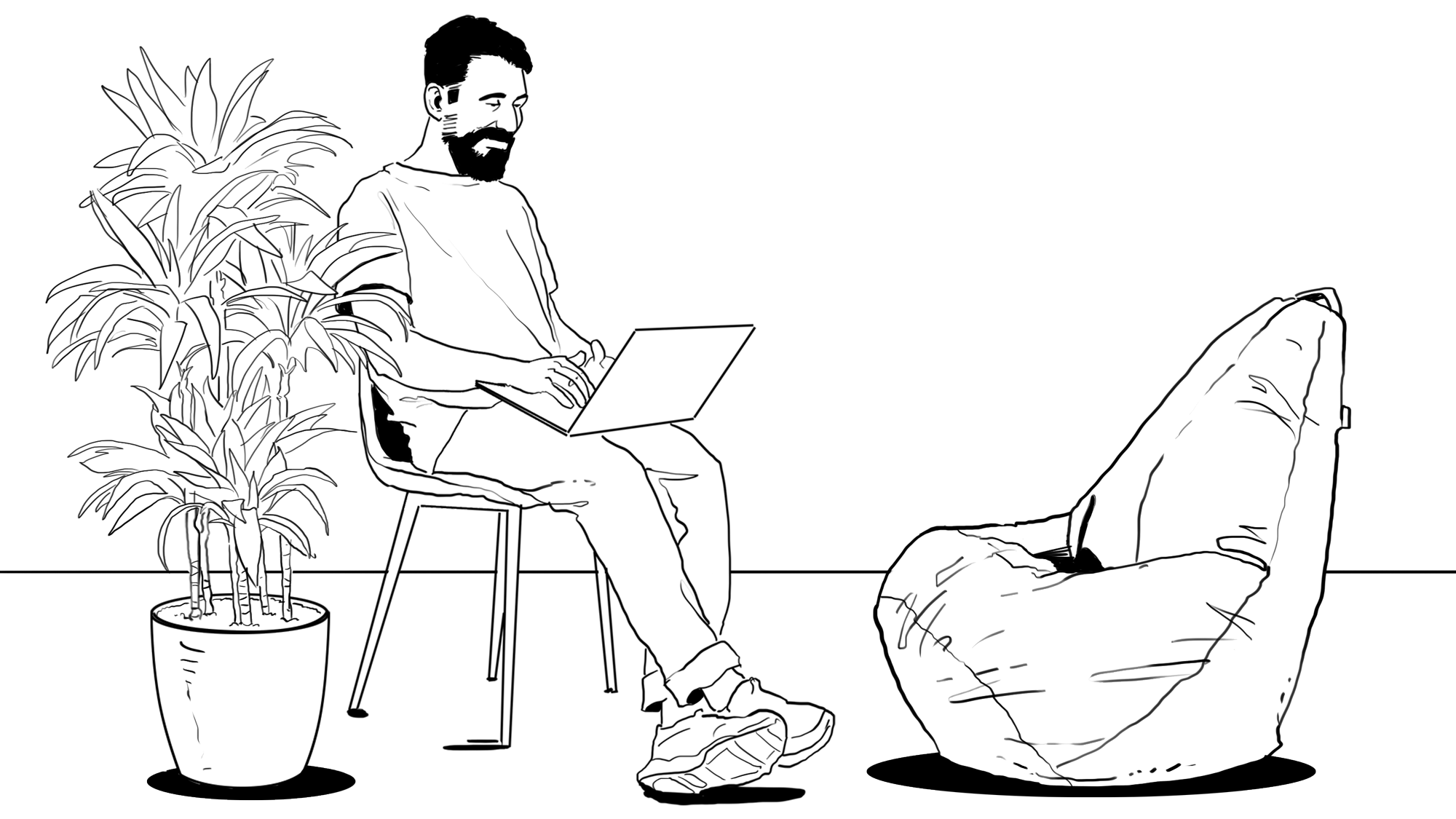 A man sitting on a chair with a laptop on his knees